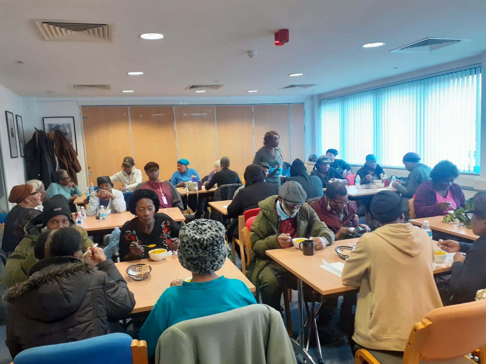 Full dining room with people enjoying meals